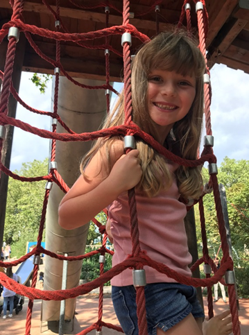 Girl on climbing frame Peckham Rye Park